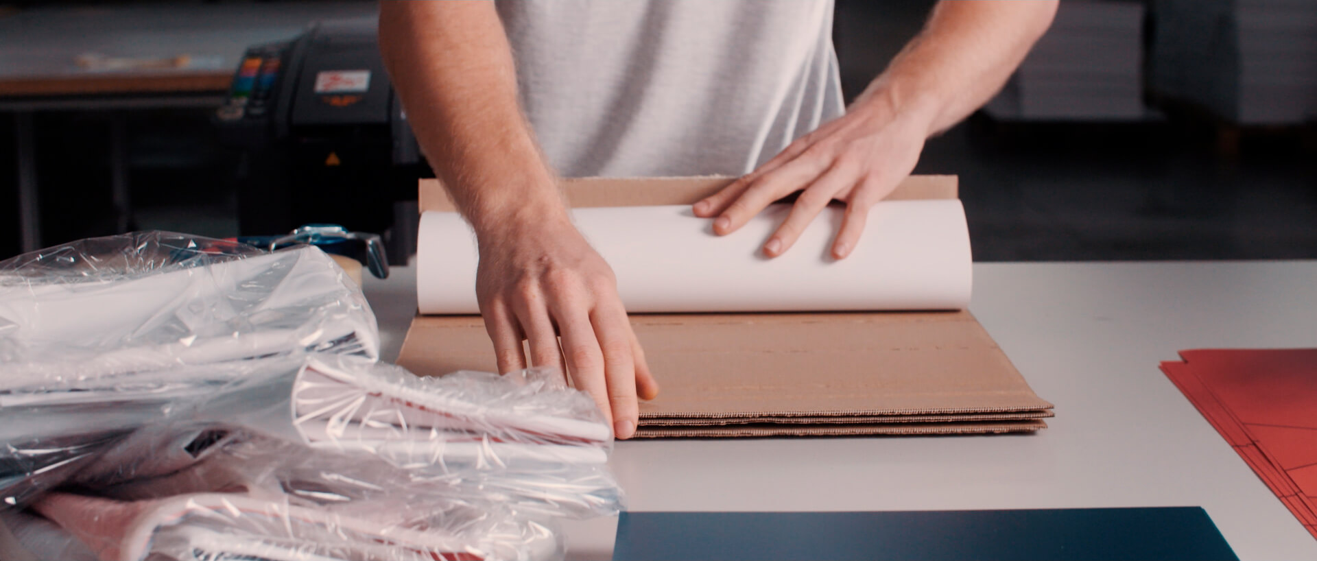Man packing printed products