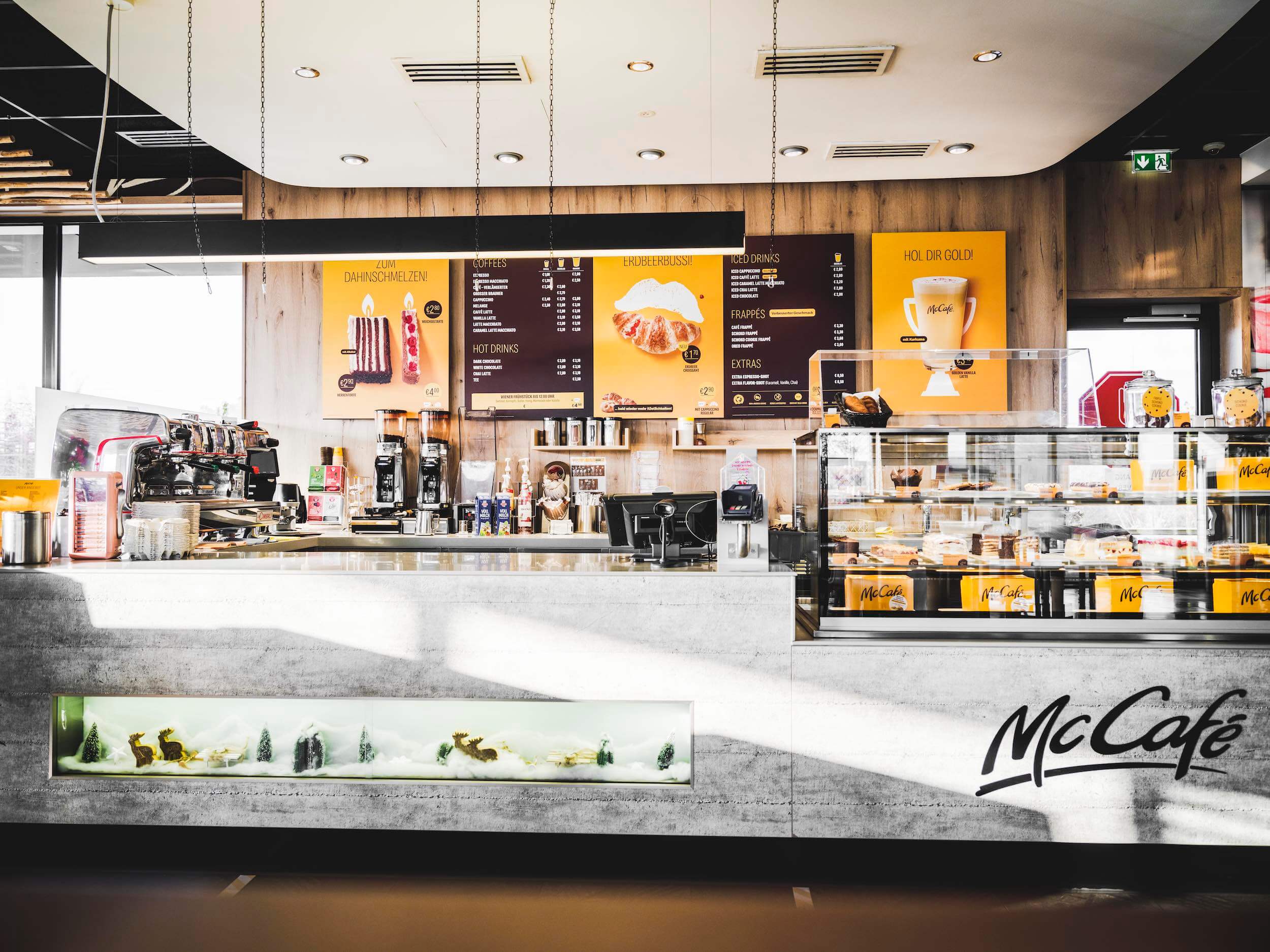 McCafe counter with menu wall signs
