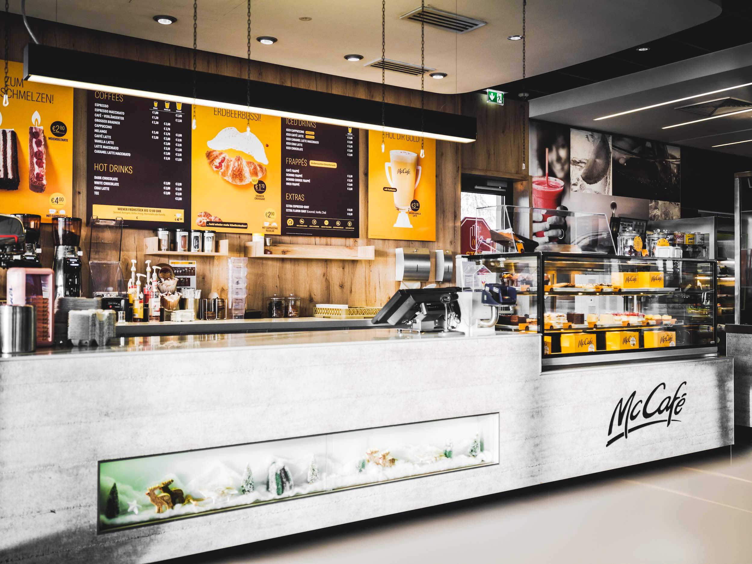 McCafe counter with printed menu posters